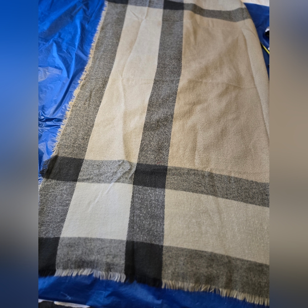 Neiman Marcus Tan And Black plaid scarf/wrap.